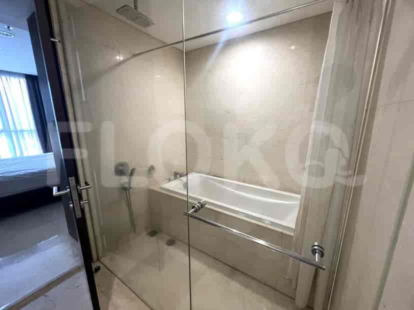 Bathroom with bathtub and glass shower.