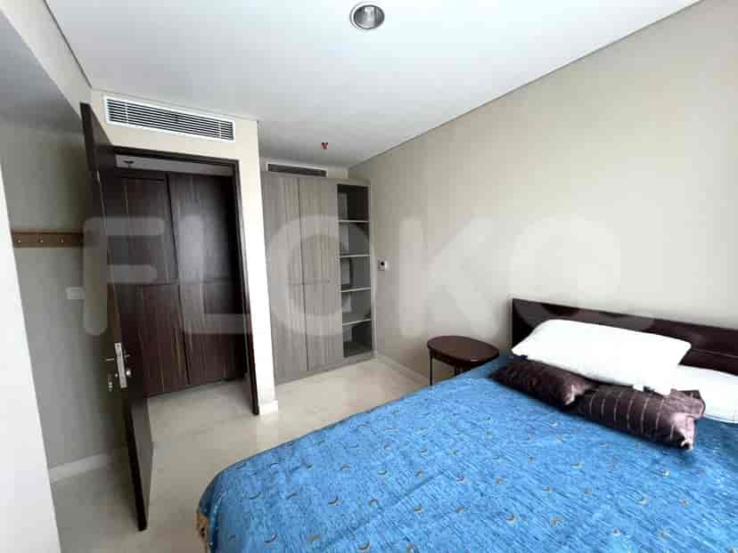 Guest bedroom with bed and wardrobe.