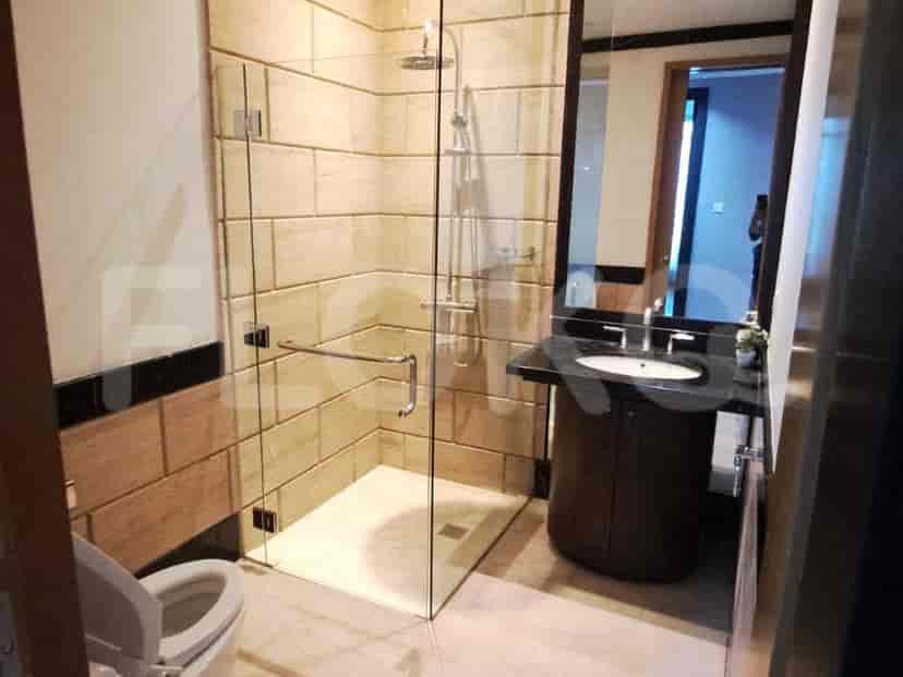Modern bathroom with a walk-in shower and vanity.