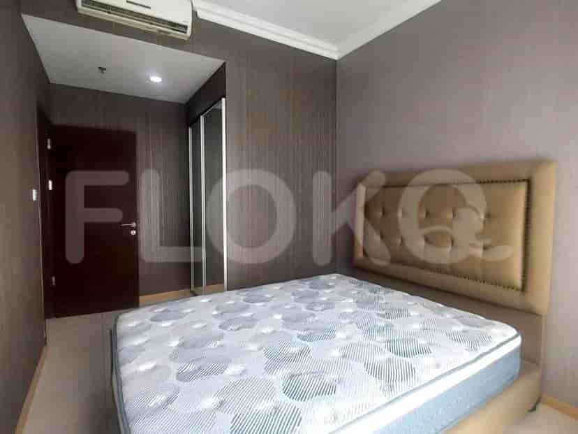 Another view of the bedroom, showing the bed and closet.