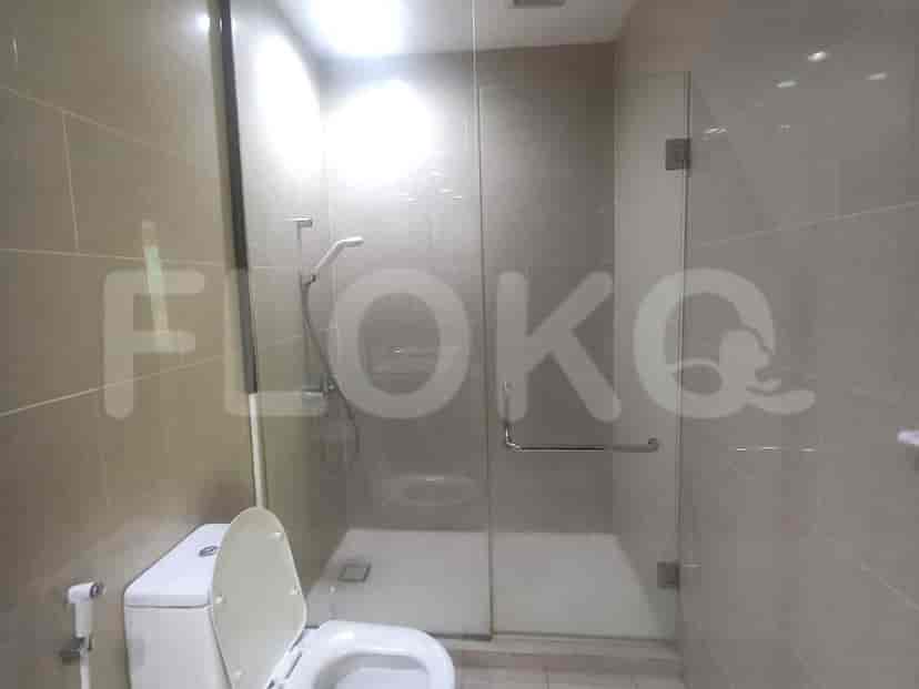 A modern bathroom with a glass-enclosed shower.