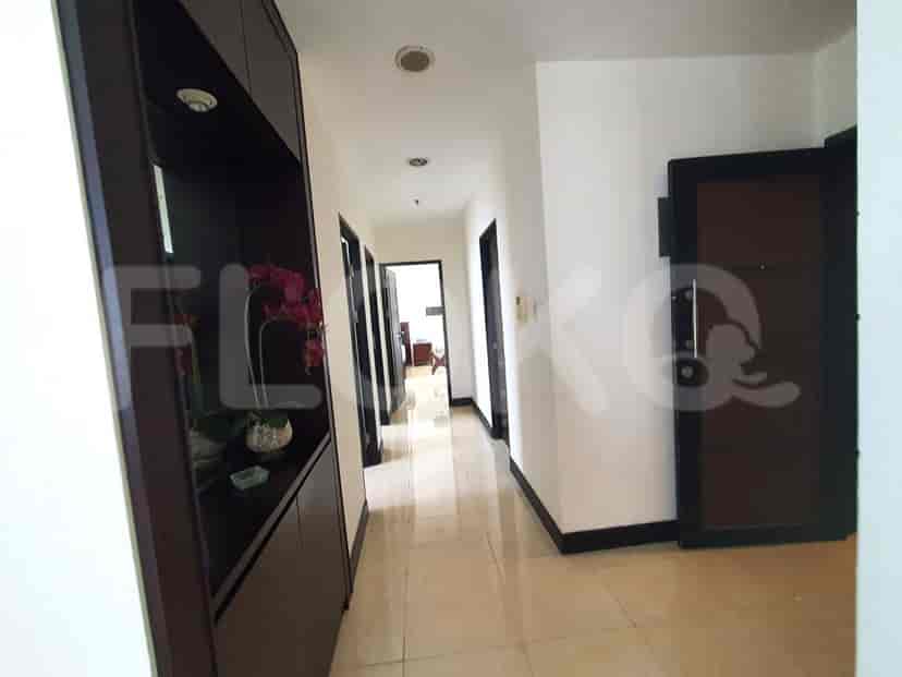 Hallway with doors and built-in storage.