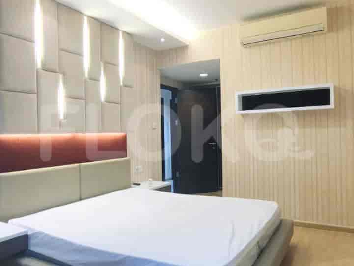 Master bedroom featuring a bed, wall panels, and an AC.