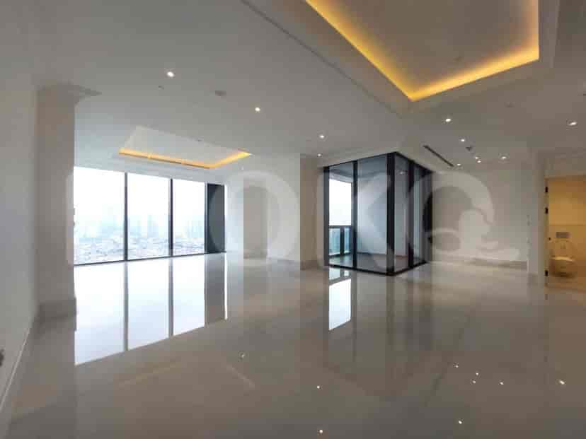 Spacious living room with large windows offering city views.