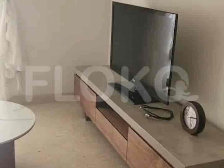 Entertainment unit with a TV, clock, and wooden paneling.