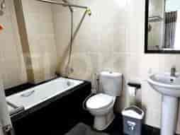 Bathroom with bathtub and other amenities.
