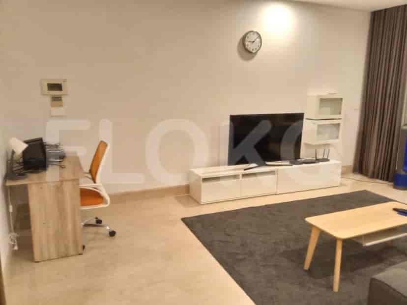Living area featuring a desk, dining area, and TV.