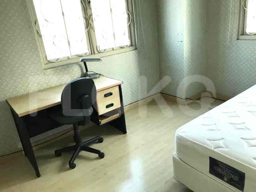 Bedroom with desk, chair, and a single bed.