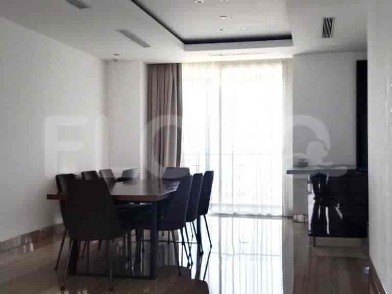 Dining area with a wooden table and chairs.