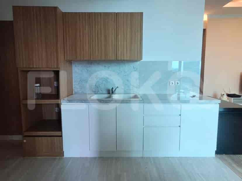 Modern kitchen with wooden cabinets and white countertops.