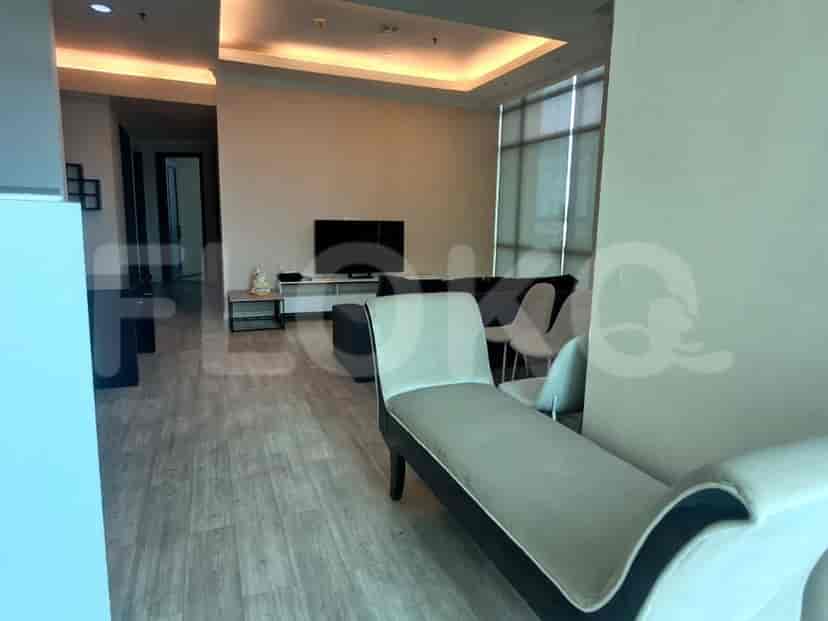 Living room showing a sofa and chairs.