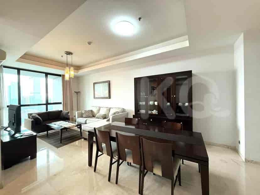 The dining area has a dark wooden dining table with six chairs and a display cabinet, and connects to the living room with city view.