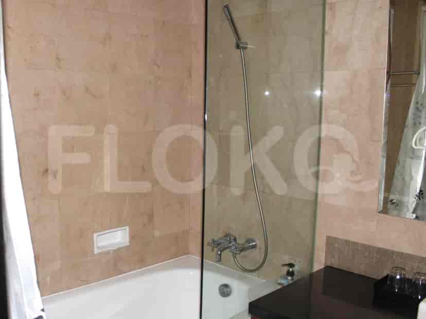 Bathroom featuring a bathtub, shower, and elegant tilework.