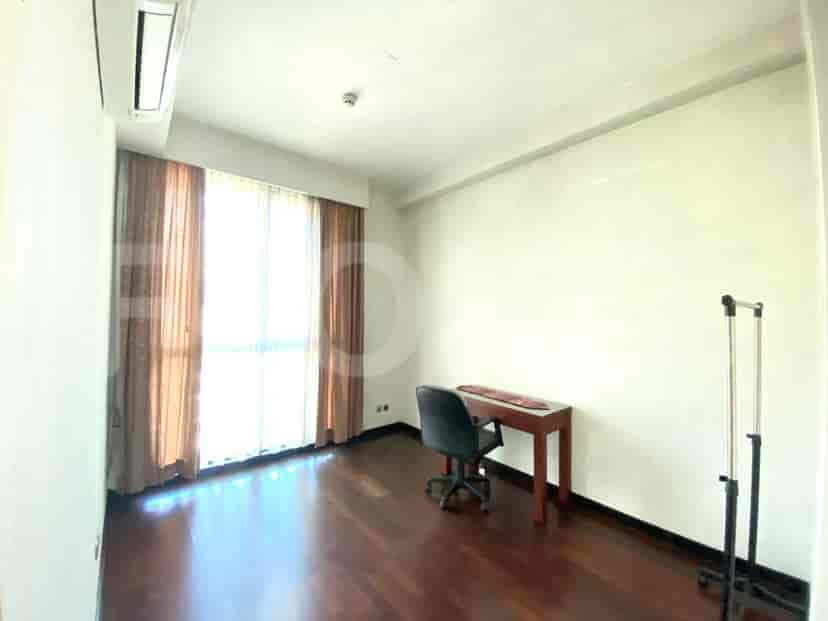 A small room with a desk and chair, likely used as an office or a small bedroom.