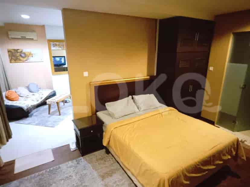 Combined view of the bedroom and living area.