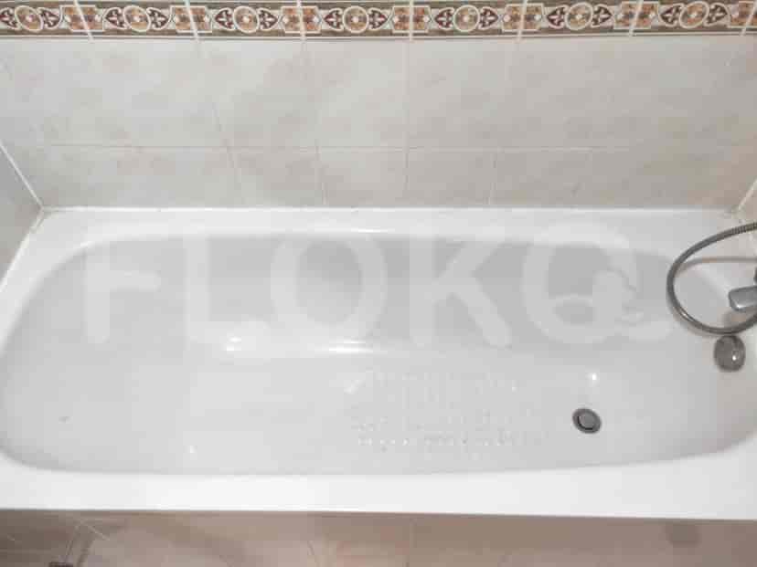 A bathroom featuring a bathtub.