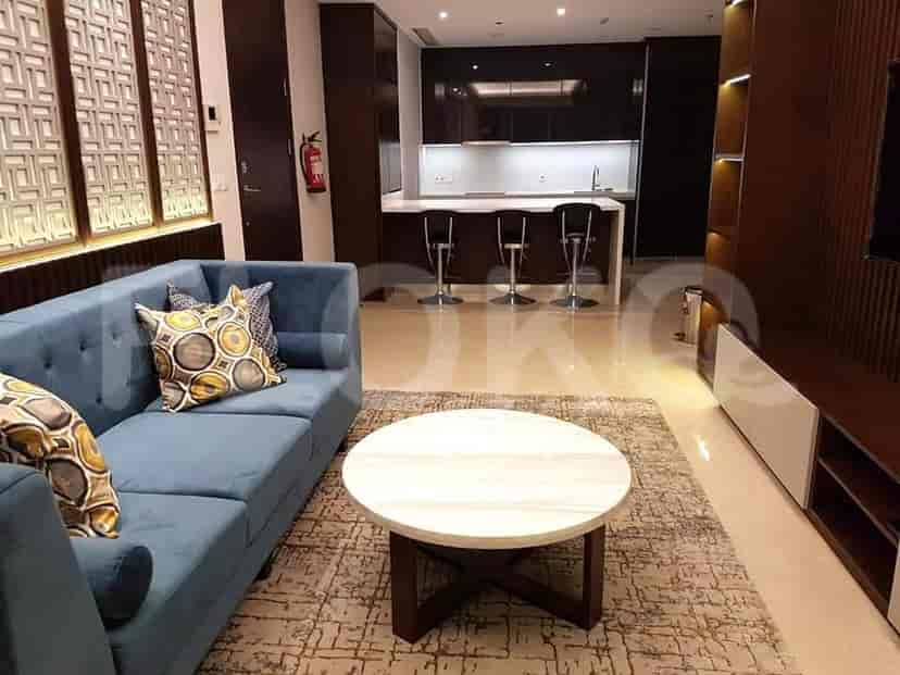 Open plan living space with a kitchen island, seating area, and a view.