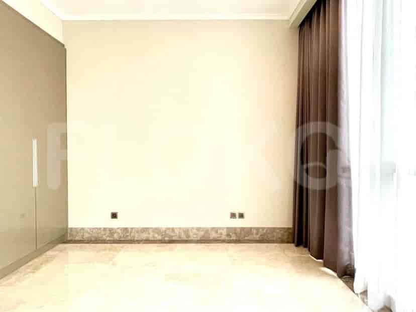 An empty room, possibly another bedroom, with minimal decor.