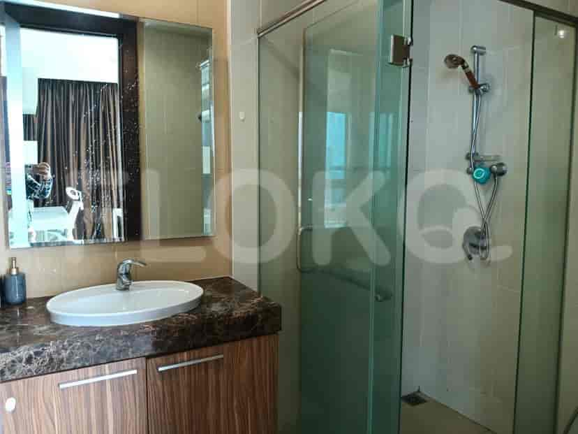 A modern bathroom with a glass shower and a vanity.