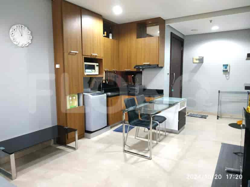 Modern kitchen with wooden cabinets and appliances.
