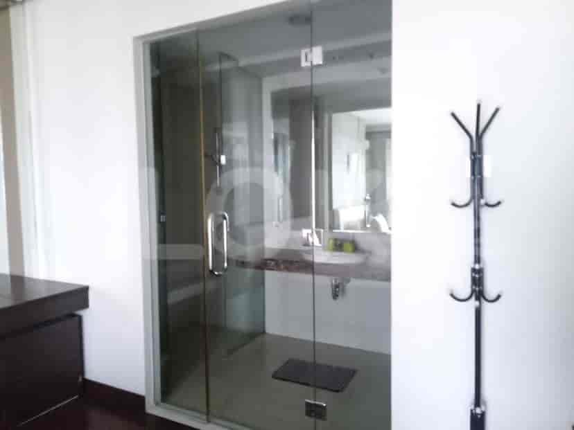 Bathroom with a shower and coat rack.