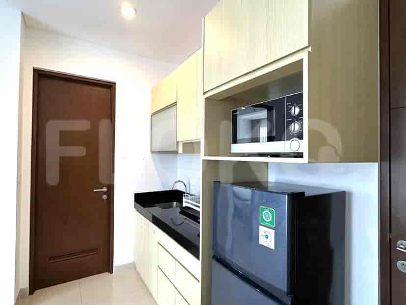 Kitchen showcasing integrated appliances and storage.