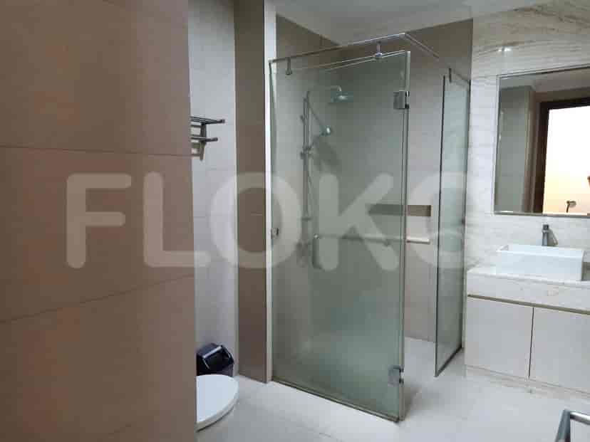 A modern bathroom with a glass shower enclosure.