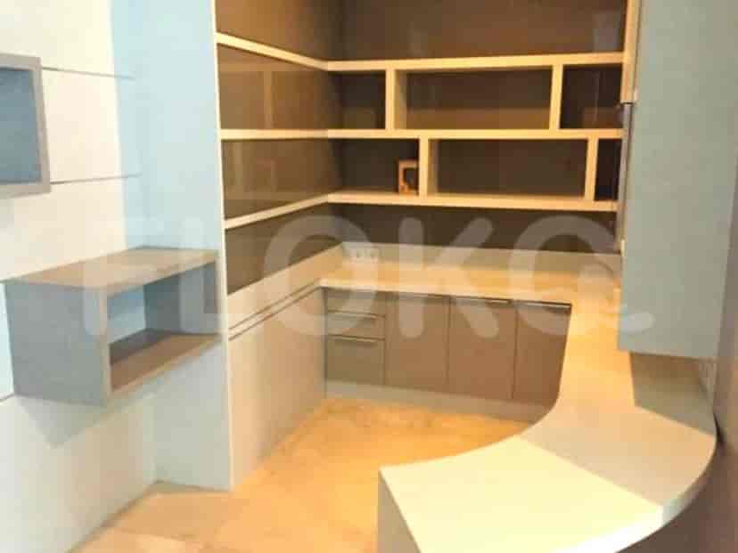 A small kitchenette with a sink and cabinets.