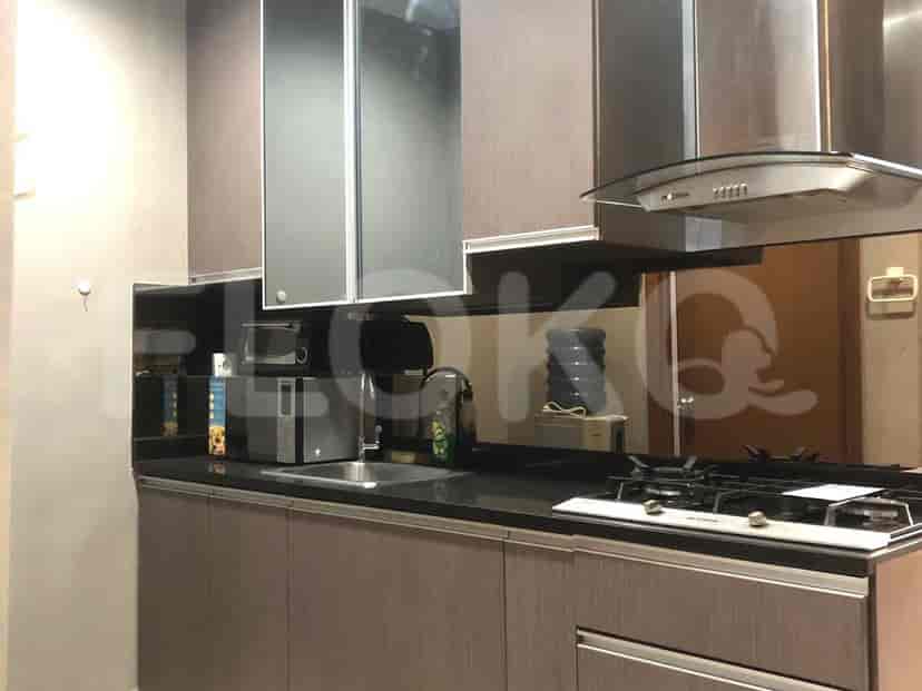 A modern kitchen with cabinets, appliances, and a countertop.