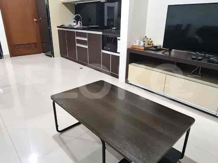 The image shows the kitchen area from the living room.