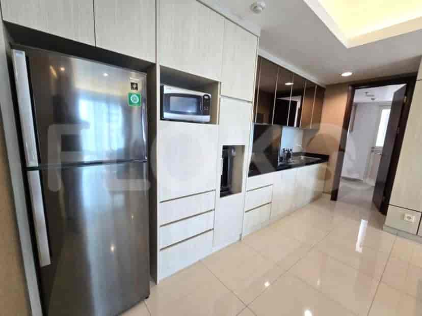 A modern kitchen with stainless steel appliances and ample cabinet space.