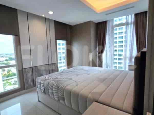 A modern bedroom featuring a large bed, window views, and elegant design.