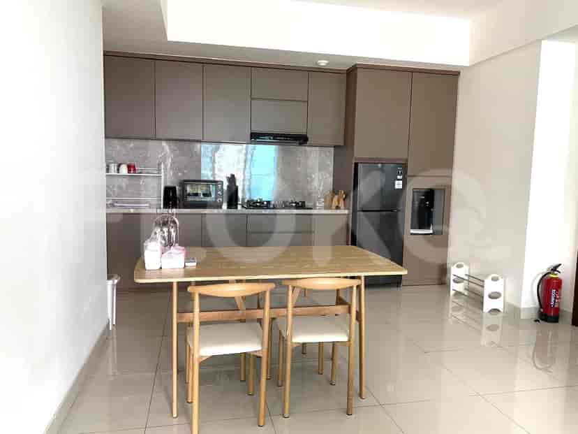 Kitchen with a table, chairs, cabinets, and appliances.