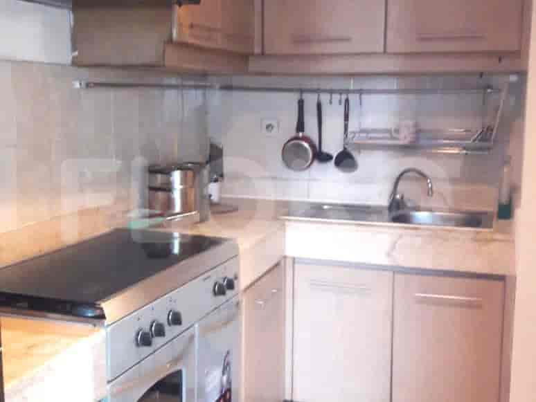 Kitchen showcasing appliances, cabinets, and a sink.