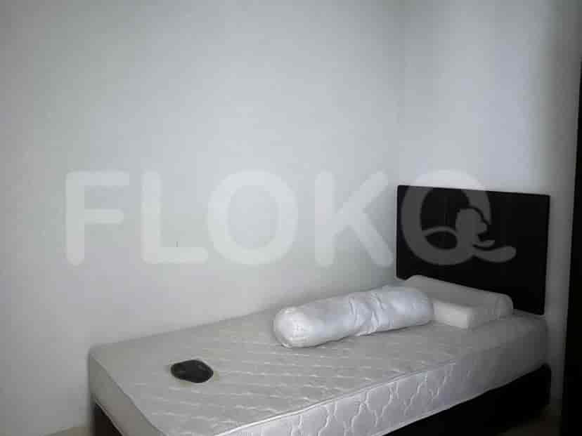 A small bedroom featuring a single bed.