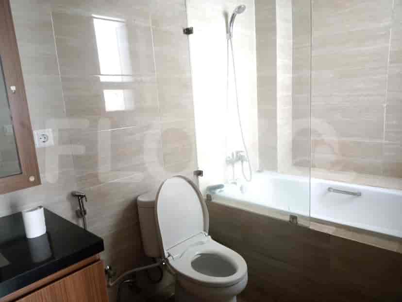 Bathroom featuring a toilet, bathtub, and shower.