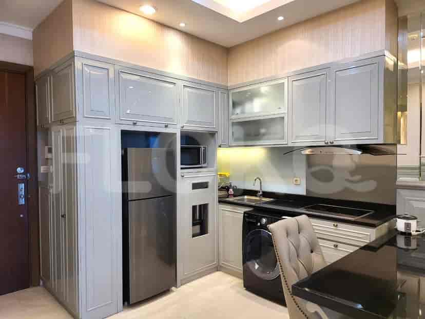 A modern kitchen featuring stainless steel appliances and ample storage.