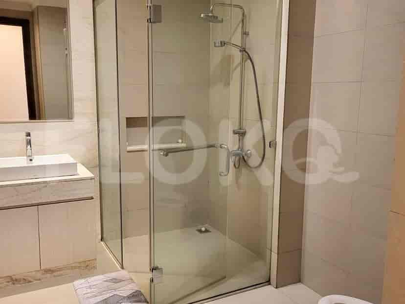 A modern bathroom with a glass shower enclosure.