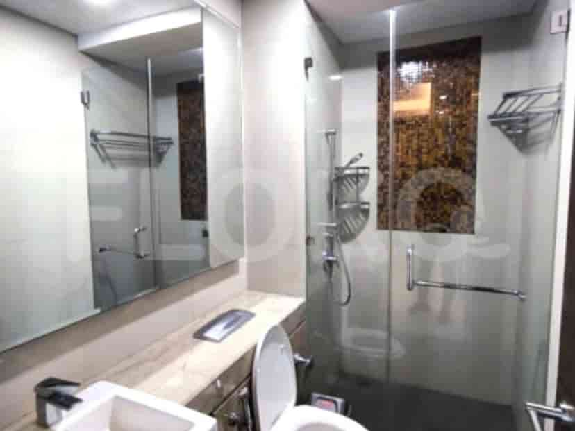 Stylish bathroom featuring a sink, shower, and a large mirror.