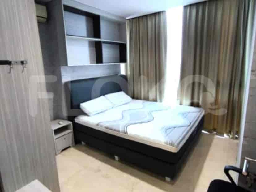 Contemporary bedroom with a bed, wall-mounted shelves, and curtains.
