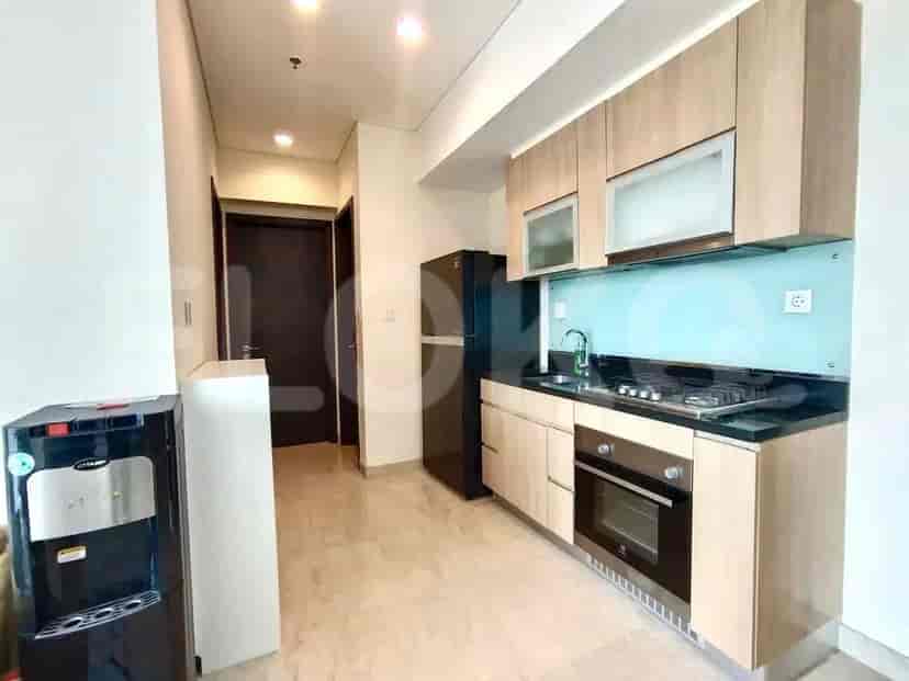 Modern kitchen with cabinets and appliances.