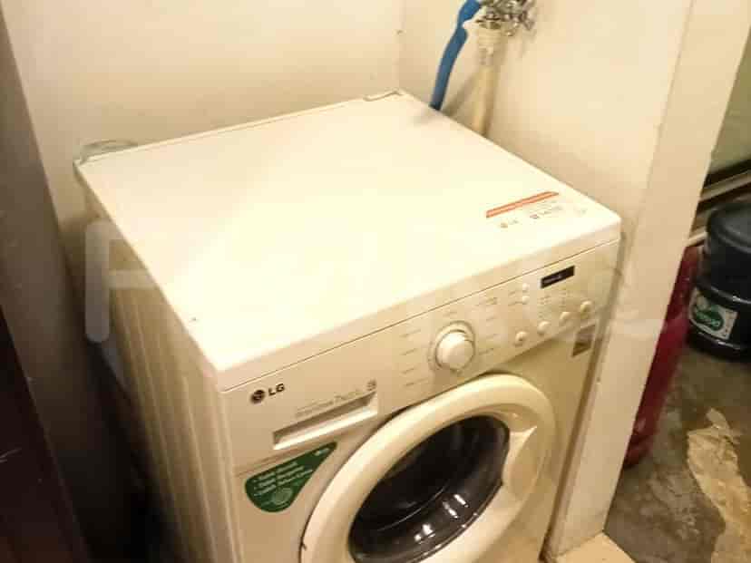 Laundry room showing a washing machine.