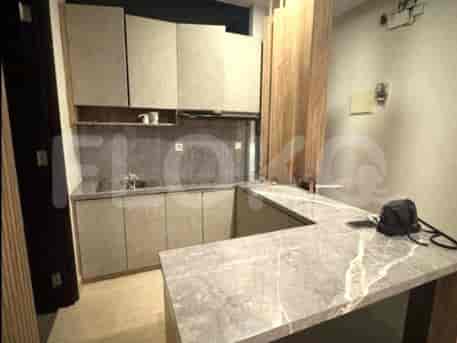 A modern kitchen with cabinets and countertops.