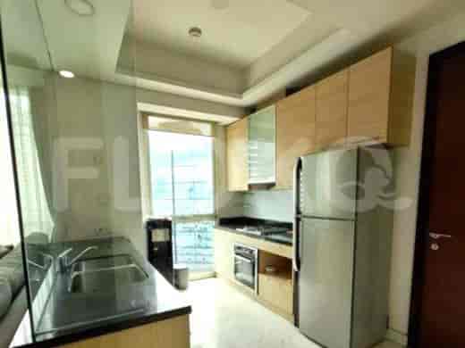 Modern kitchen with wooden cabinets and stainless steel appliances.
