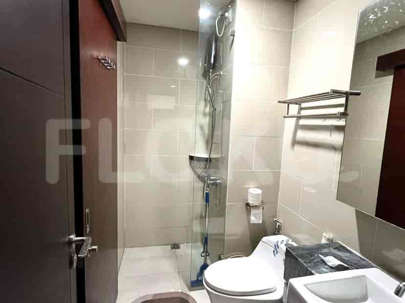 A modern bathroom with a walk-in shower and contemporary fixtures.
