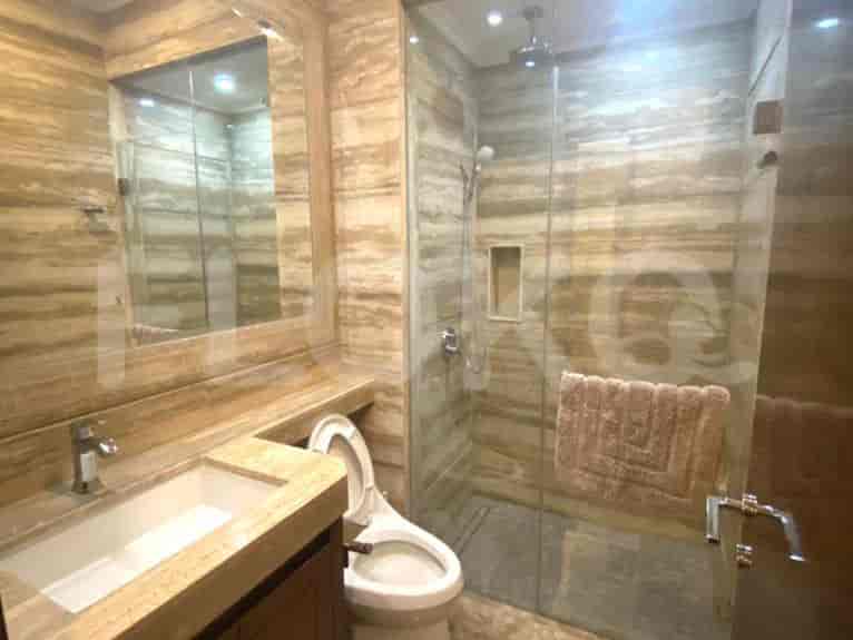 Luxurious bathroom with a glass shower and modern fixtures.
