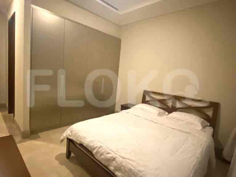 Another bedroom with a double bed and a large wardrobe.