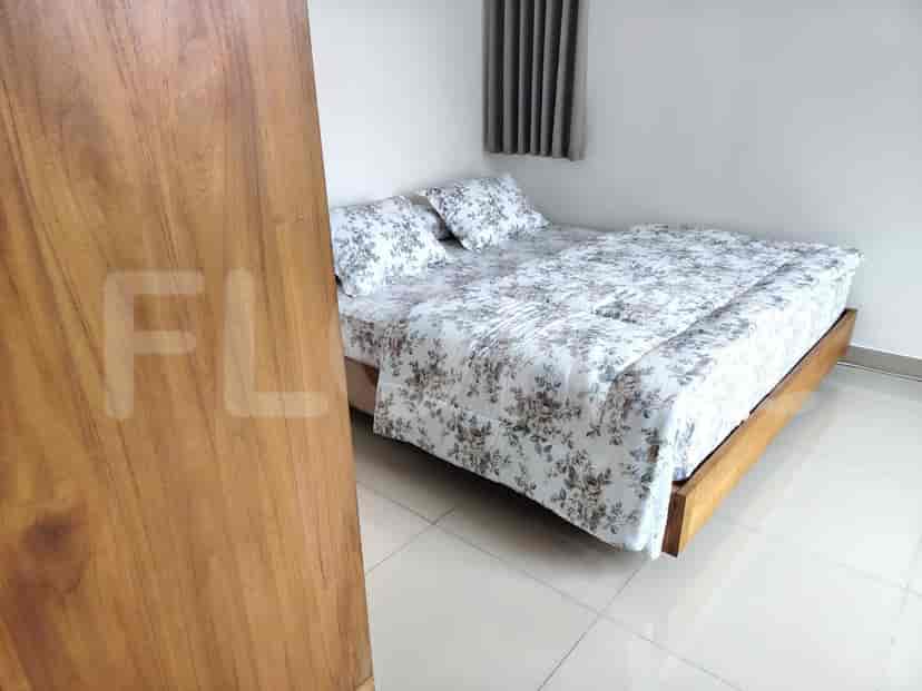 Bedroom with a double bed and floral bedding.