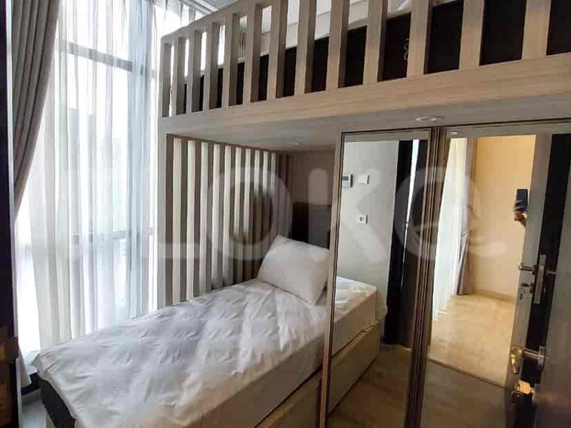 Loft bedroom featuring a single bed and closet.