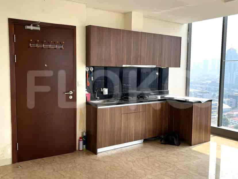 A kitchen with a small counter and cabinets.
